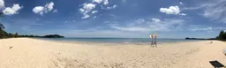 panorama with white sand, blue sky and the ocean on Ko Lanta, Thailand